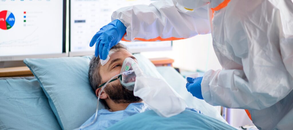 Infected patient in quarantine lying in bed in hospital