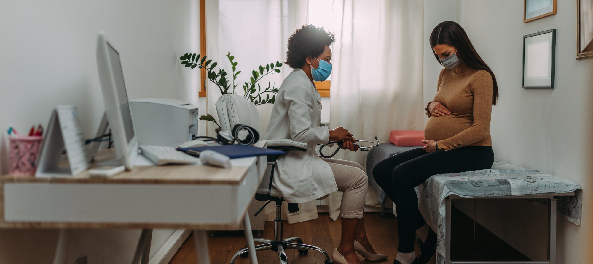 Young woman on pregnancy exam during Covid 19
