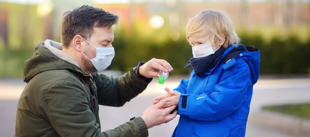 Man and Kid Wearing Face Coverings for Safety